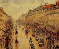 Boulevard Montmartre tarde bajo la lluvia 1897 Camille Pissarro parisino
